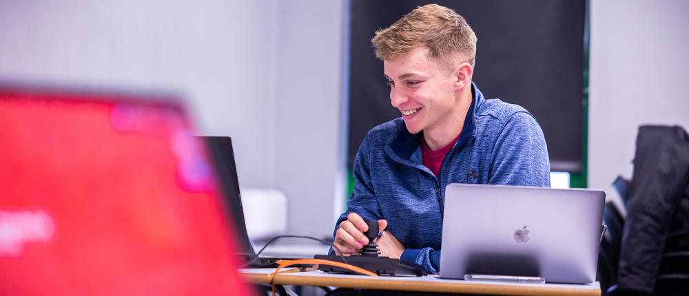 Sport Student Working On Laptop