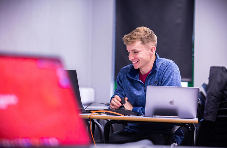 Sport Student Working On Laptop